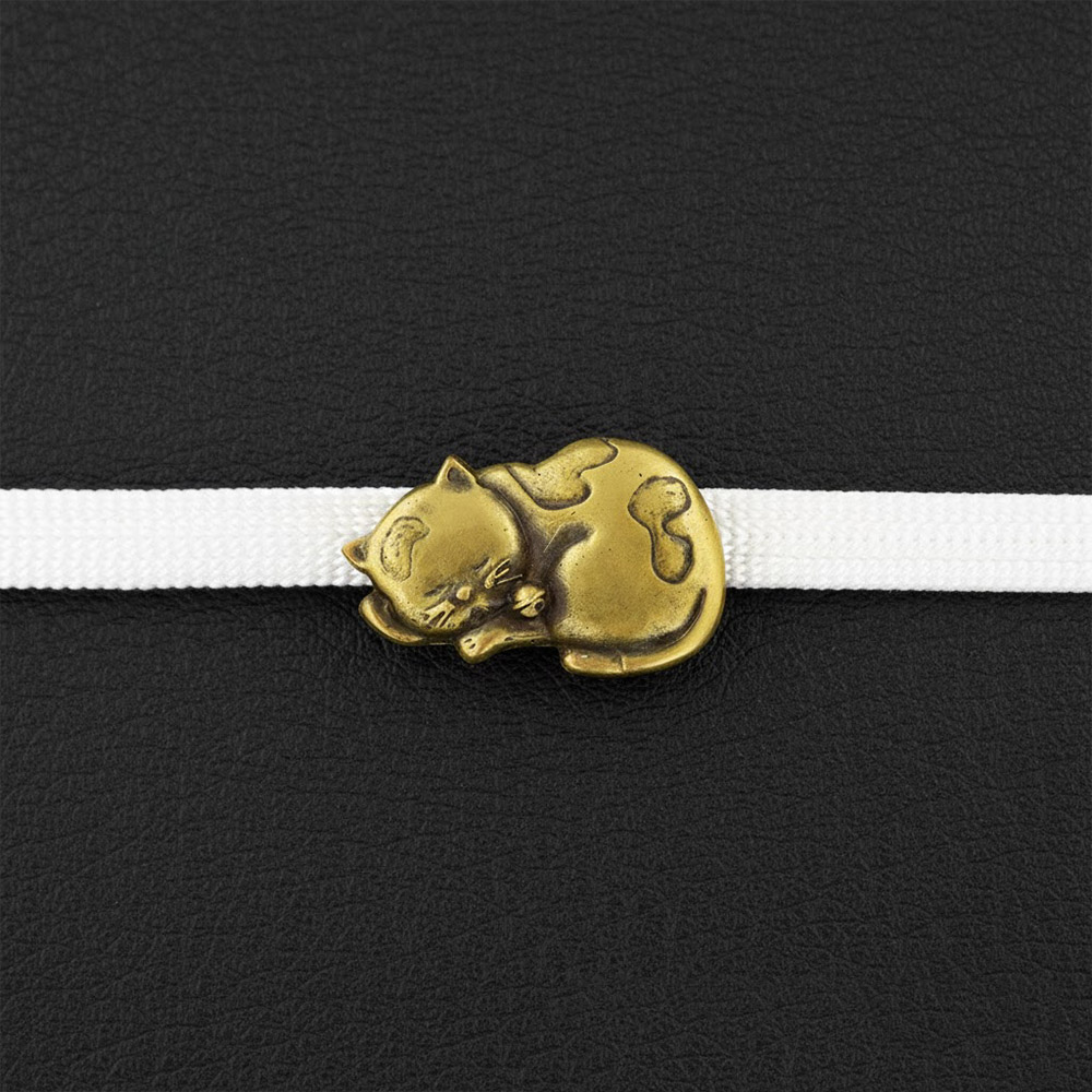 真鍮製帯留(眠り猫)【大原商店】